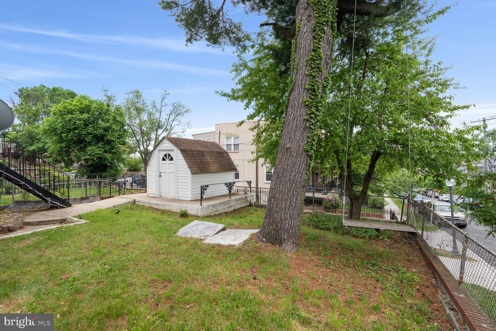 4528 4th Street Northwest Washington, DC 20011 - Photo 26 of 28 a view of a trees and barn in the middle of a yard