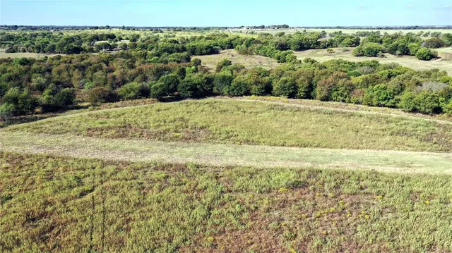 a view of a large mountain with a mountain in the background