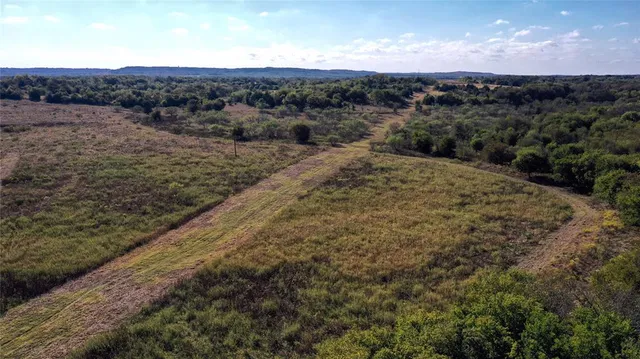 a view of lake with green space