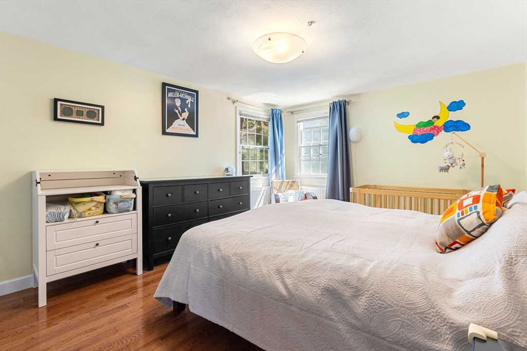 30 Granite Street Dedham, MA 02026 - Photo 16 of 36 a bedroom with a bed and a dresser