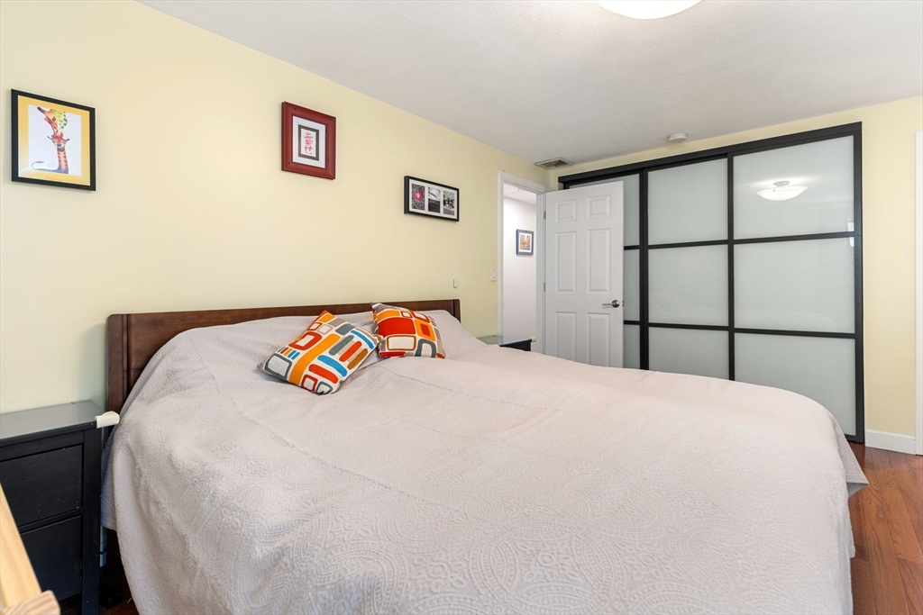 30 Granite Street Dedham, MA 02026 - Photo 17 of 36 a bedroom with a bed and a large window