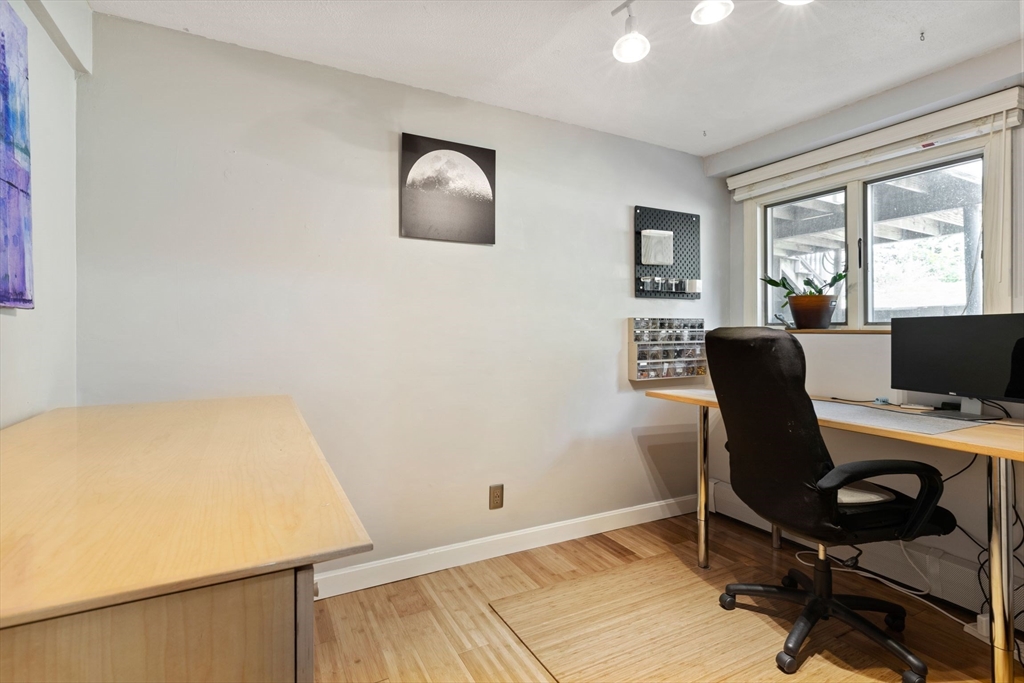 30 Granite Street Dedham, MA 02026 - Photo 22 of 36 a view of a workspace with furniture and a window
