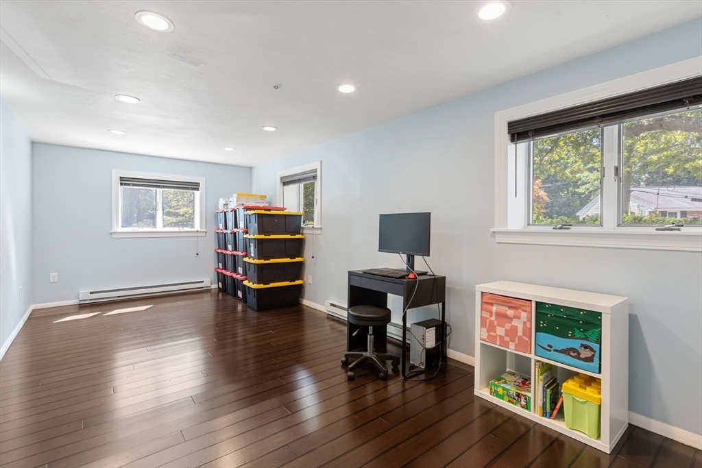 30 Granite Street Dedham, MA 02026 - Photo 23 of 36 a living room with furniture and a wooden floor