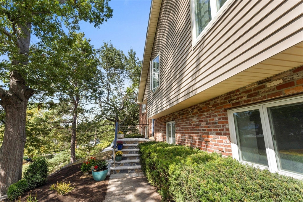 30 Granite Street Dedham, MA 02026 - Photo 31 of 36 a view of a house with a yard