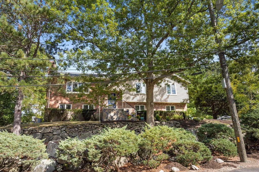 30 Granite Street Dedham, MA 02026 - Photo 32 of 36 a front view of a house with a yard