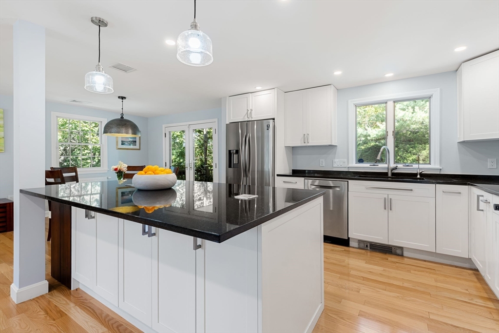 30 Granite Street Dedham, MA 02026 - Photo 4 of 36 a kitchen with stainless steel appliances a sink stove and refrigerator