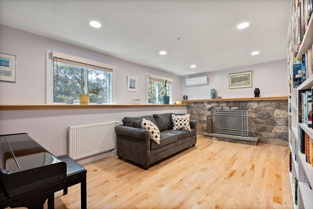 30 Granite Street Dedham, MA 02026 - Photo 9 of 36 a living room with furniture and a flat screen tv