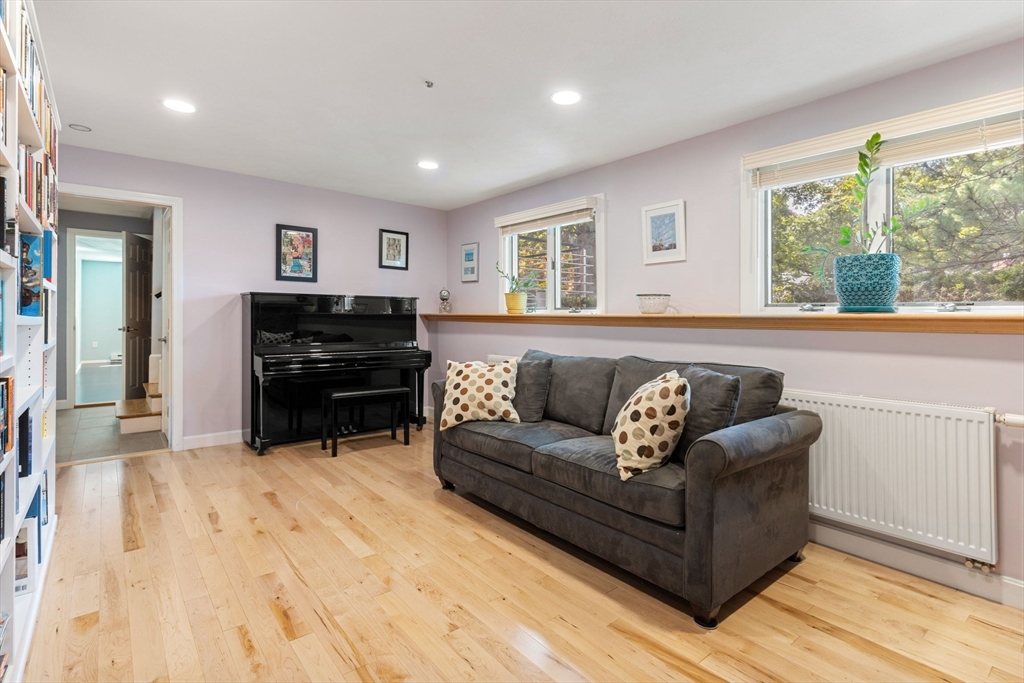 30 Granite Street Dedham, MA 02026 - Photo 10 of 36 a living room with furniture and a flat screen tv