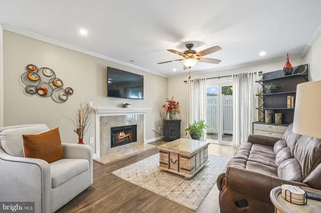 a living room with furniture fireplace and a flat screen tv