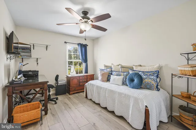 a bedroom with furniture and a window