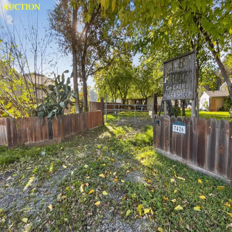a view of yard with patio