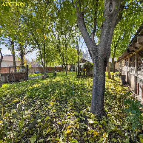 a backyard of a house with lots of green space