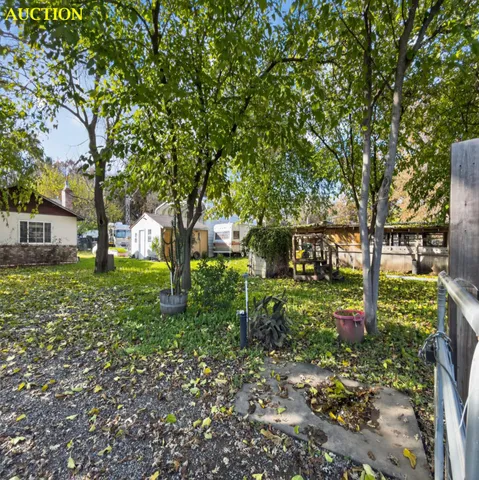 a backyard of a house with lots of green space