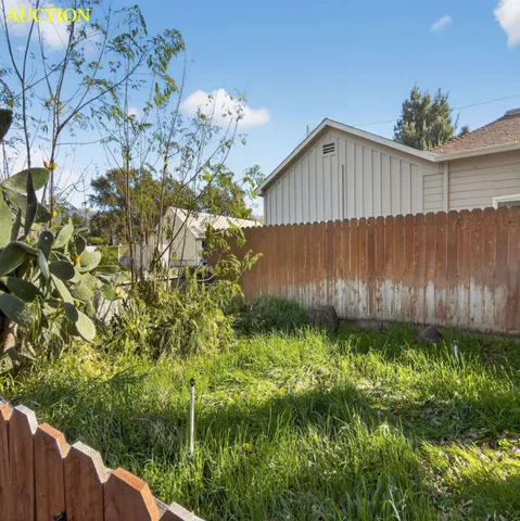 a backyard of a house with lots of green space