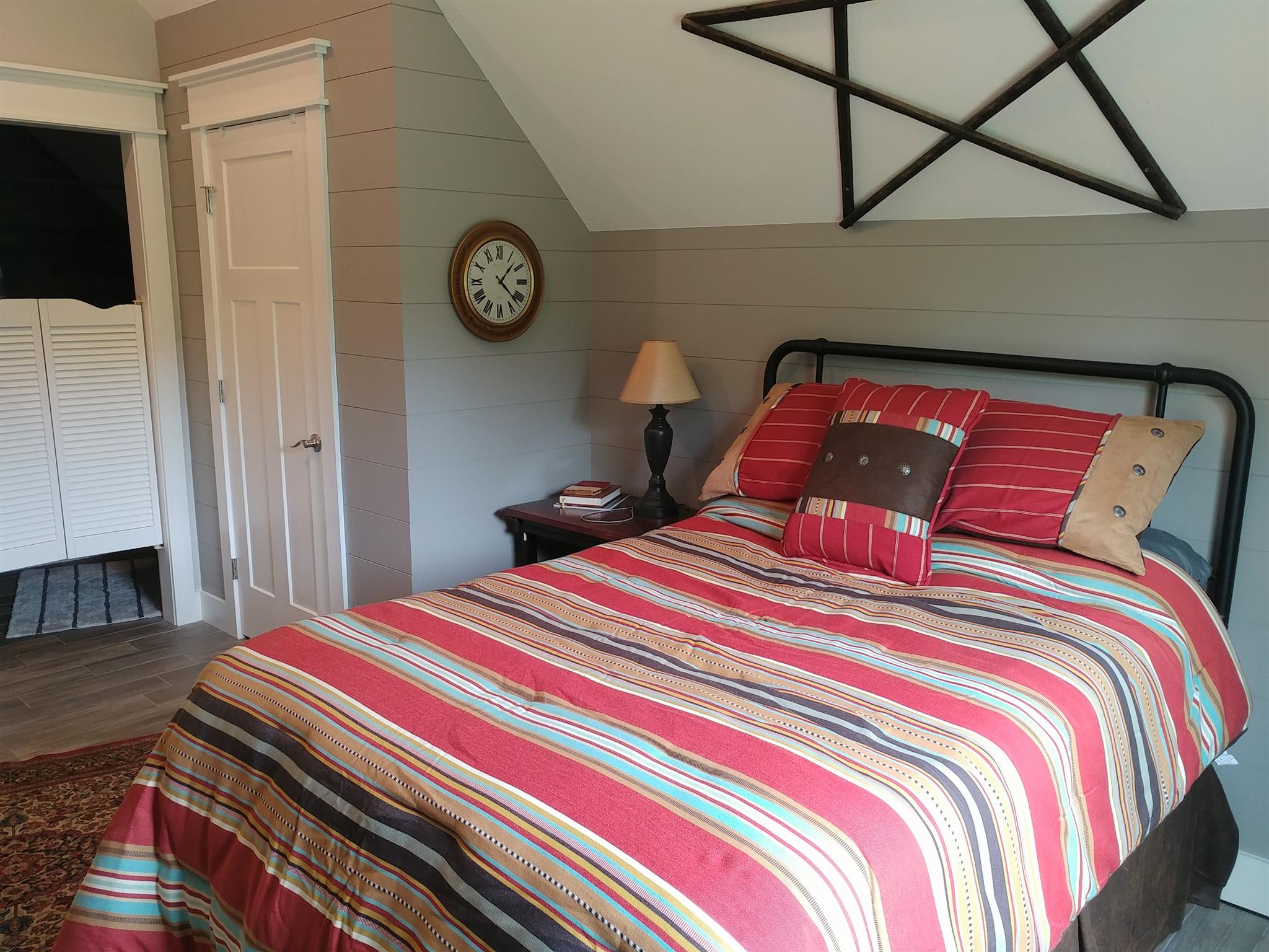 4055 Flewellyn Road Springfield, TN 37172 - Photo 17 of 28 a bedroom with a bed and a tv on table
