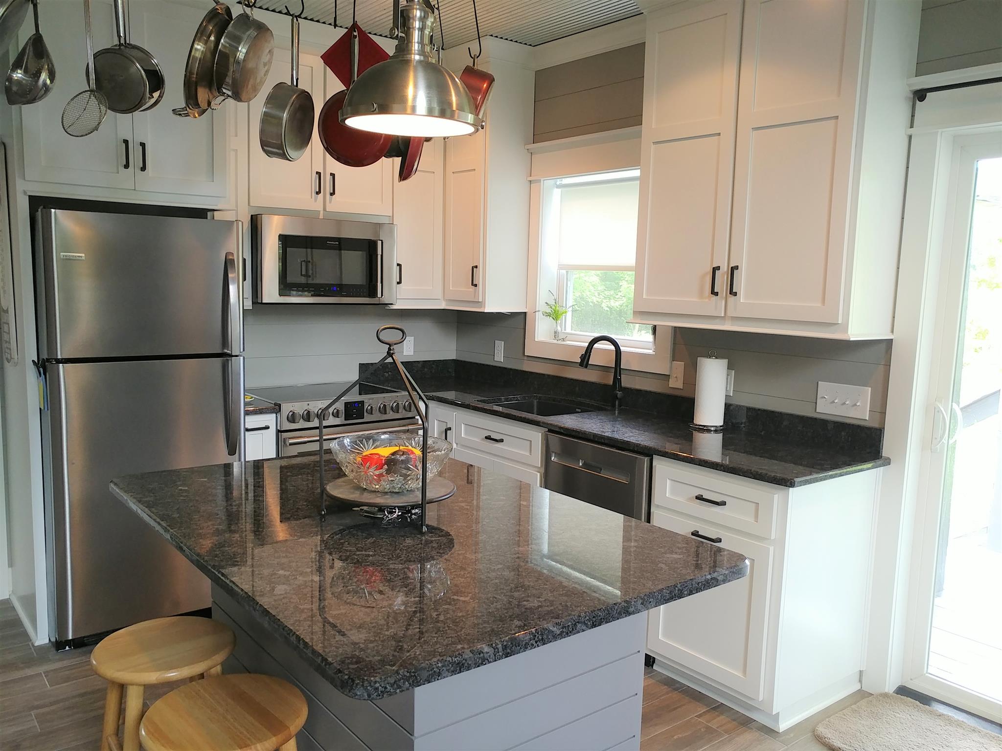 4055 Flewellyn Road Springfield, TN 37172 - Photo 10 of 28 a kitchen with stainless steel appliances granite countertop a sink a stove and a refrigerator