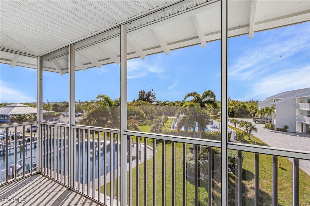 16641 Stringfellow Road, Unit 506 Bokeelia, FL 33922 - Photo 24 of 43 a view of a street from a balcony