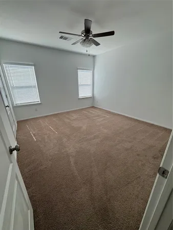 a view of empty room with windows