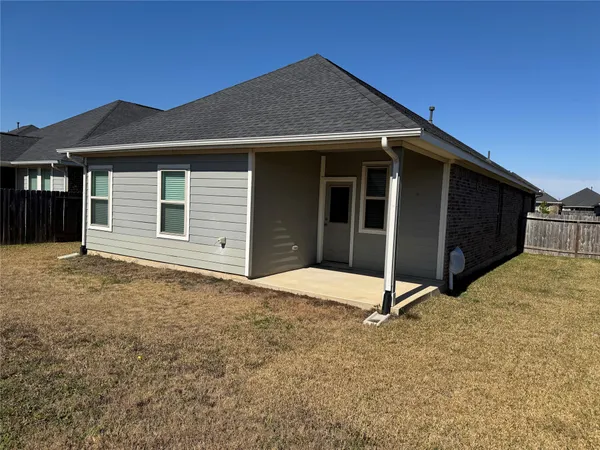 a house with yard in front of it
