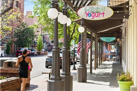 a view of a street with shops