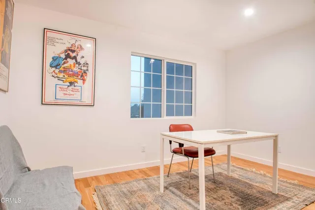 a workspace with furniture and a window