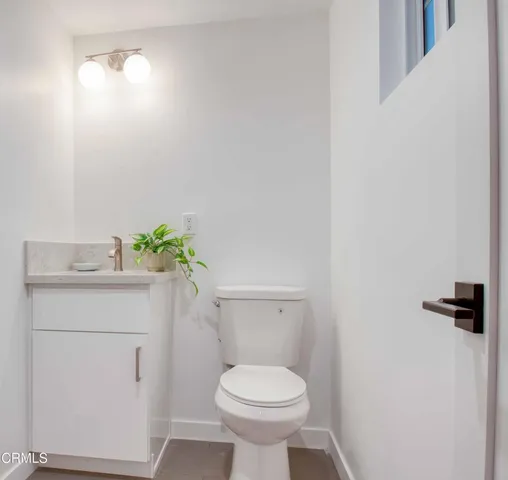 a bathroom with a toilet and a sink