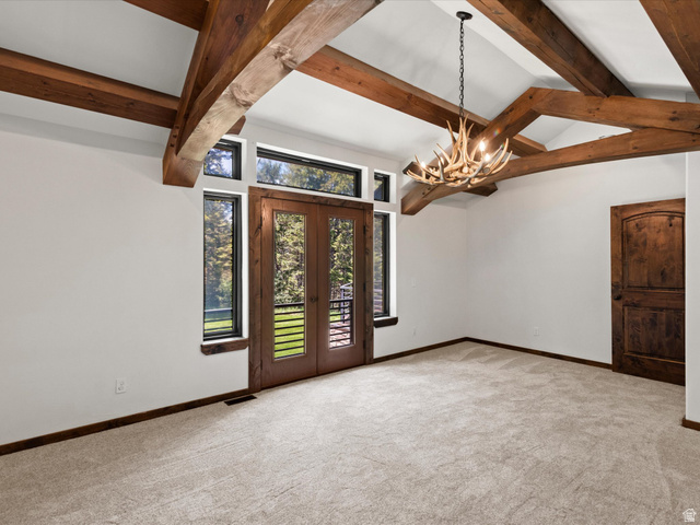 1225 Old Oregon Road Soda Springs, ID 83276 - Photo 39 of 67 Vaulted ceiling featuring exposed wood beams and an antler-style chandelier
