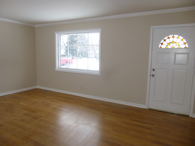 577 Redwood Road Bolingbrook, IL 60440 - Photo 2 of 20 an empty room with wooden floor and windows
