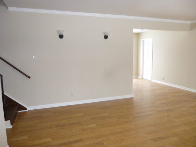 577 Redwood Road Bolingbrook, IL 60440 - Photo 6 of 20 a view of an empty room with wooden floor and a window