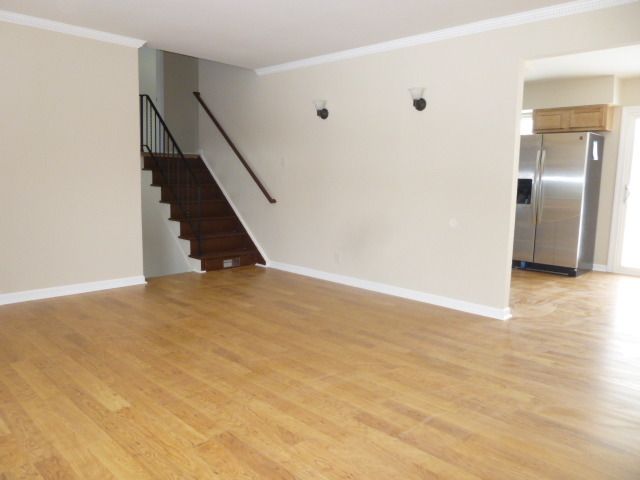 577 Redwood Road Bolingbrook, IL 60440 - Photo 7 of 20 a view of an empty room with wooden floor