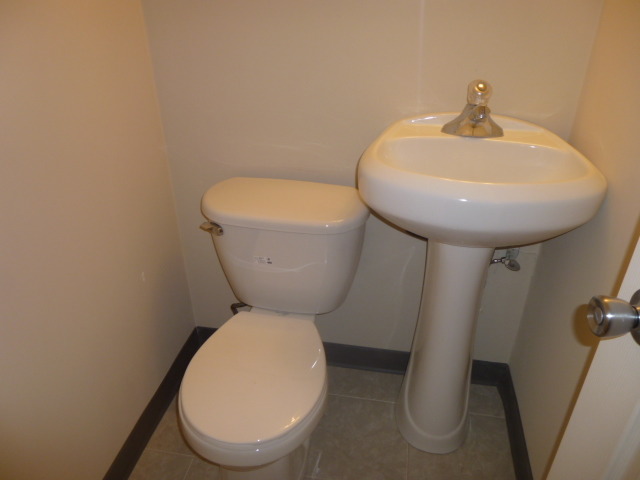 577 Redwood Road Bolingbrook, IL 60440 - Photo 10 of 20 a bathroom with a toilet sink and mirror