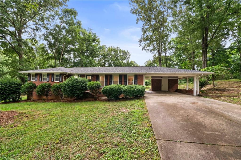 23 East Camelia Road Northeast Rome, GA 30161 - Photo 2 of 27 front view of a house with a yard