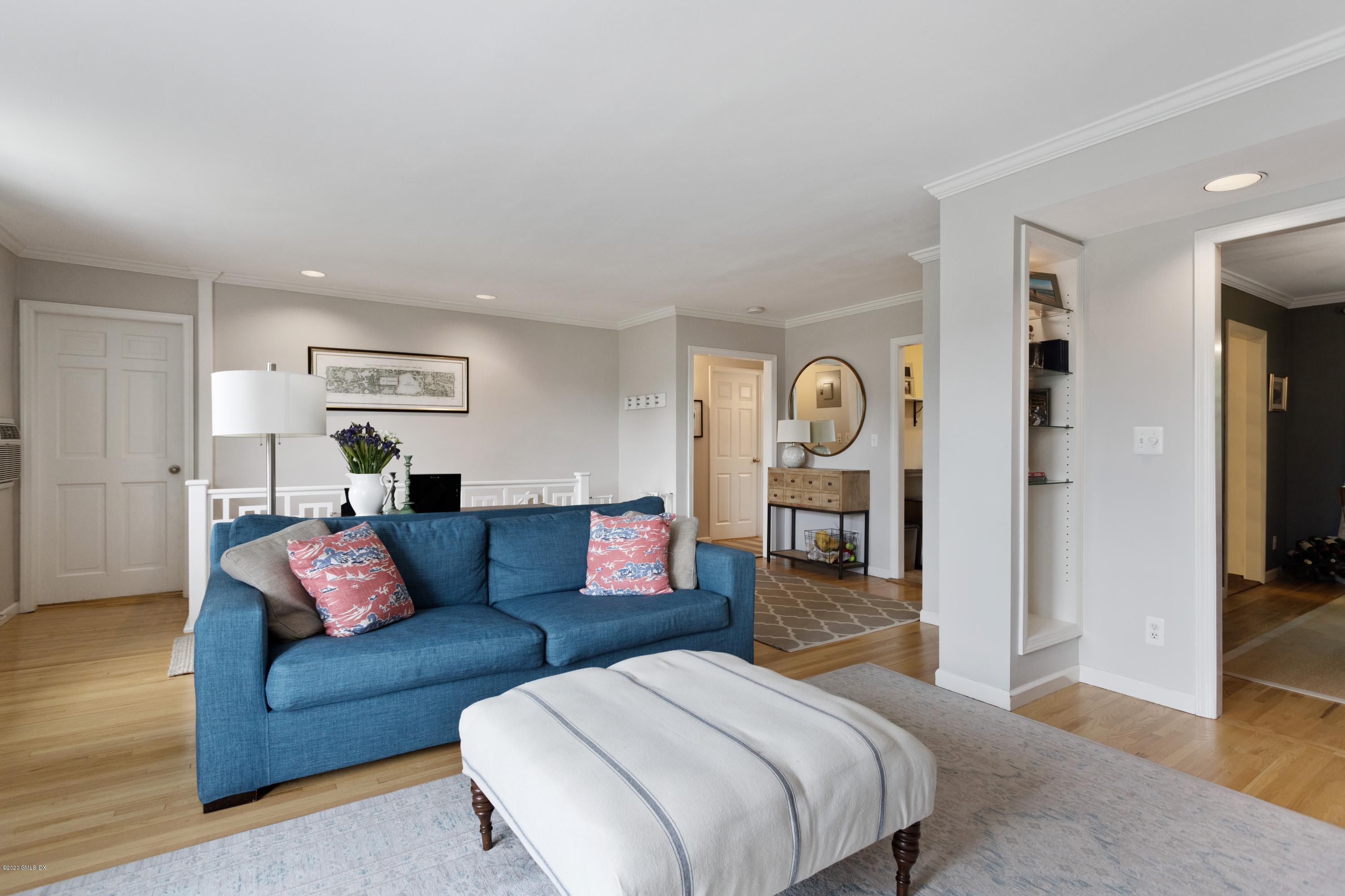 100 Putnam Park, Unit 100 Greenwich, CT 06830 - Photo 2 of 15 a bedroom with furniture and wooden floor