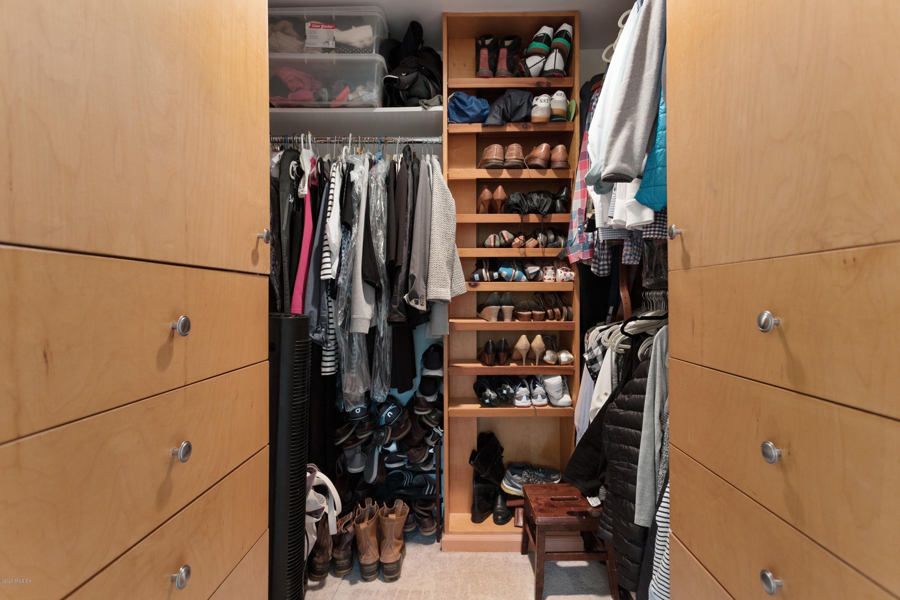 100 Putnam Park, Unit 100 Greenwich, CT 06830 - Photo 10 of 15 a view of walk in closet with clothes and shoes