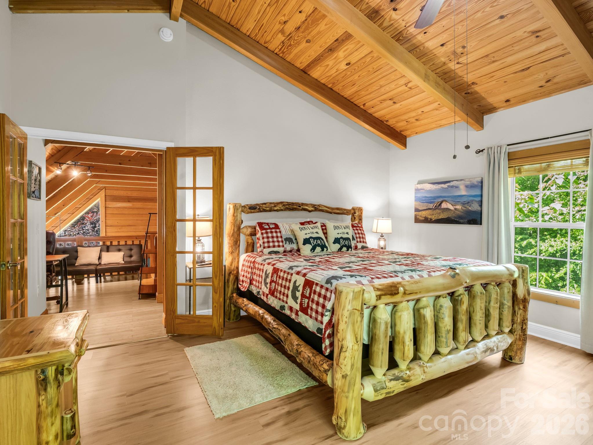 165 Dream Road Hendersonville, NC 28792 - Photo 33 of 46 a bed sitting in a spacious bedroom next to a window
