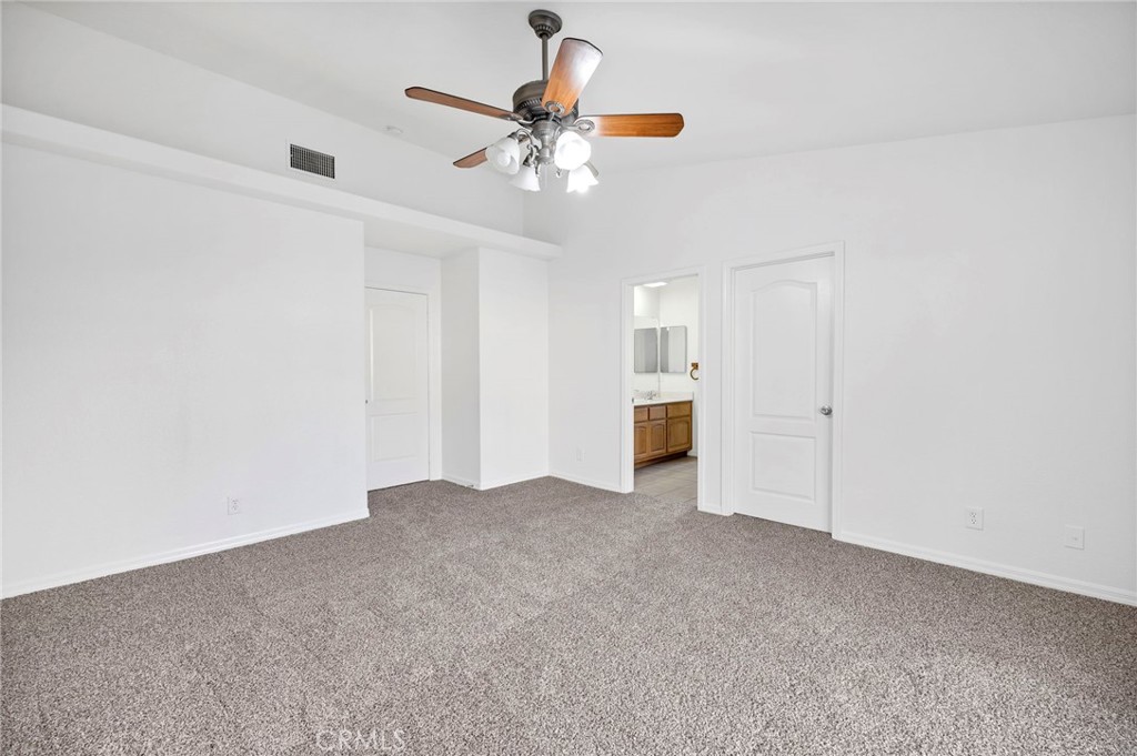 1230 Shellie Lane Hemet, CA 92543 - Photo 20 of 44 a view of an empty room with a ceiling fan