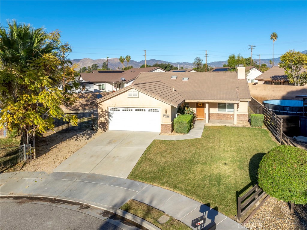 1230 Shellie Lane Hemet, CA 92543 - Photo 2 of 44 an aerial view of a house with a swimming pool
