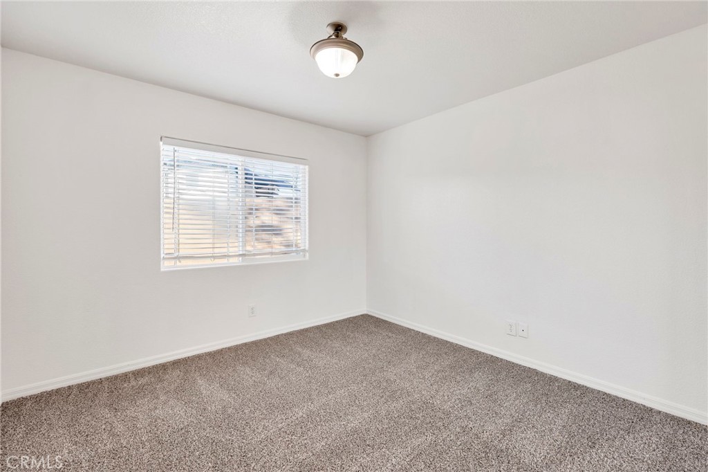 1230 Shellie Lane Hemet, CA 92543 - Photo 25 of 44 an empty room with a window