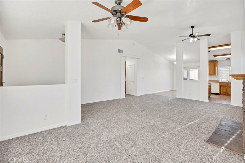 1230 Shellie Lane Hemet, CA 92543 - Photo 7 of 44 a view of a big room with chandelier fan and windows