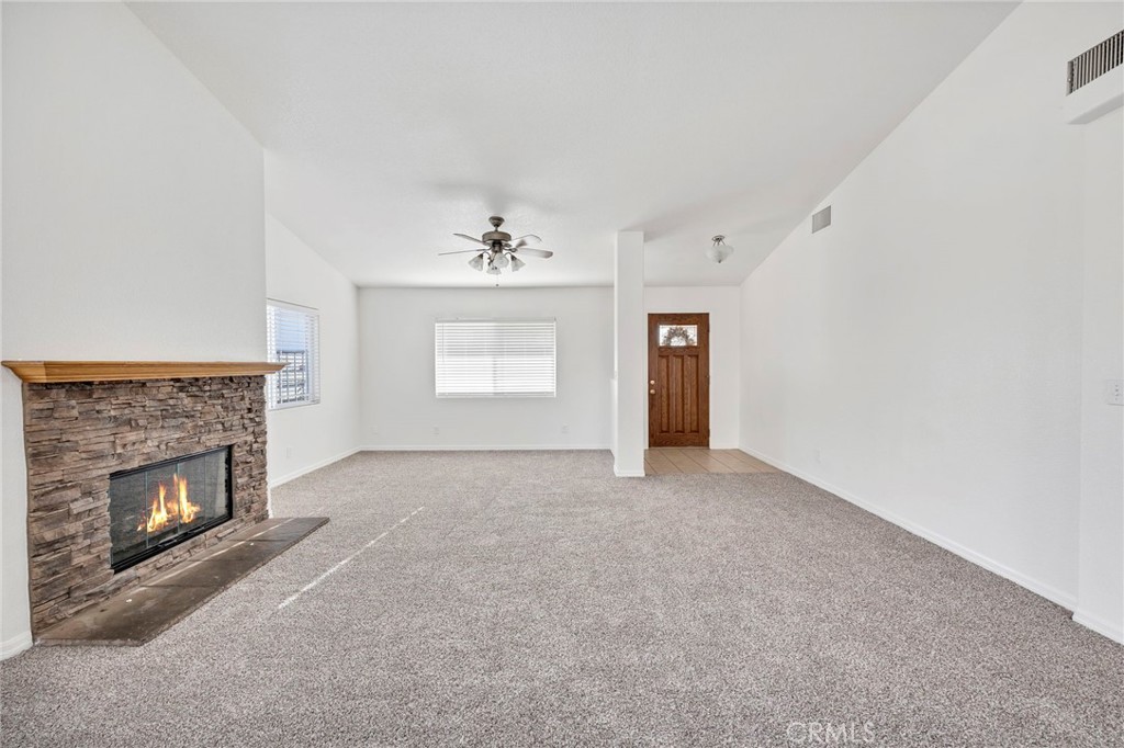 1230 Shellie Lane Hemet, CA 92543 - Photo 10 of 44 an empty room with windows and fireplace
