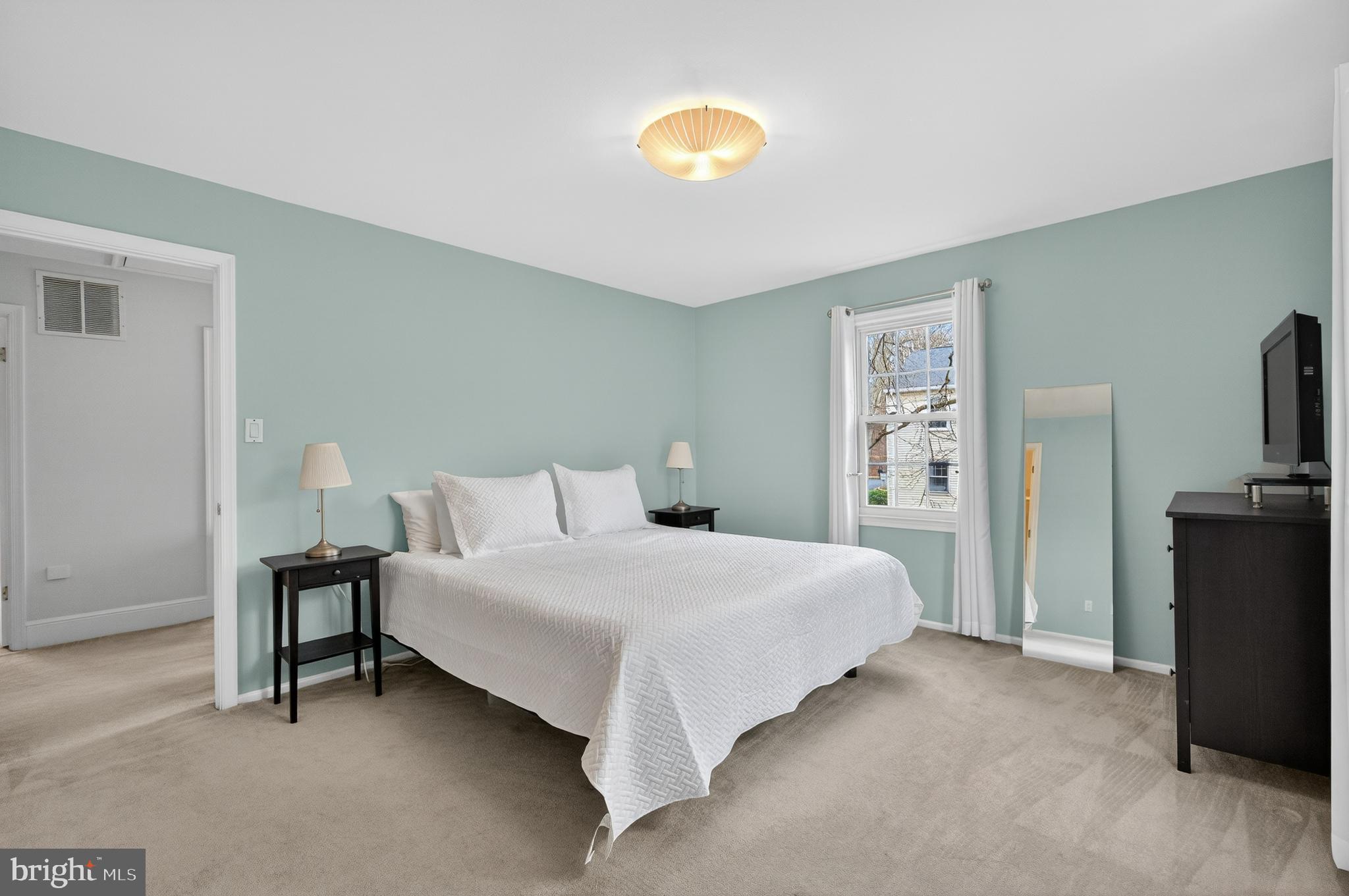 5624 Kirkham Court Springfield, VA 22151 - Photo 18 of 52 a bedroom with a bed and a television
