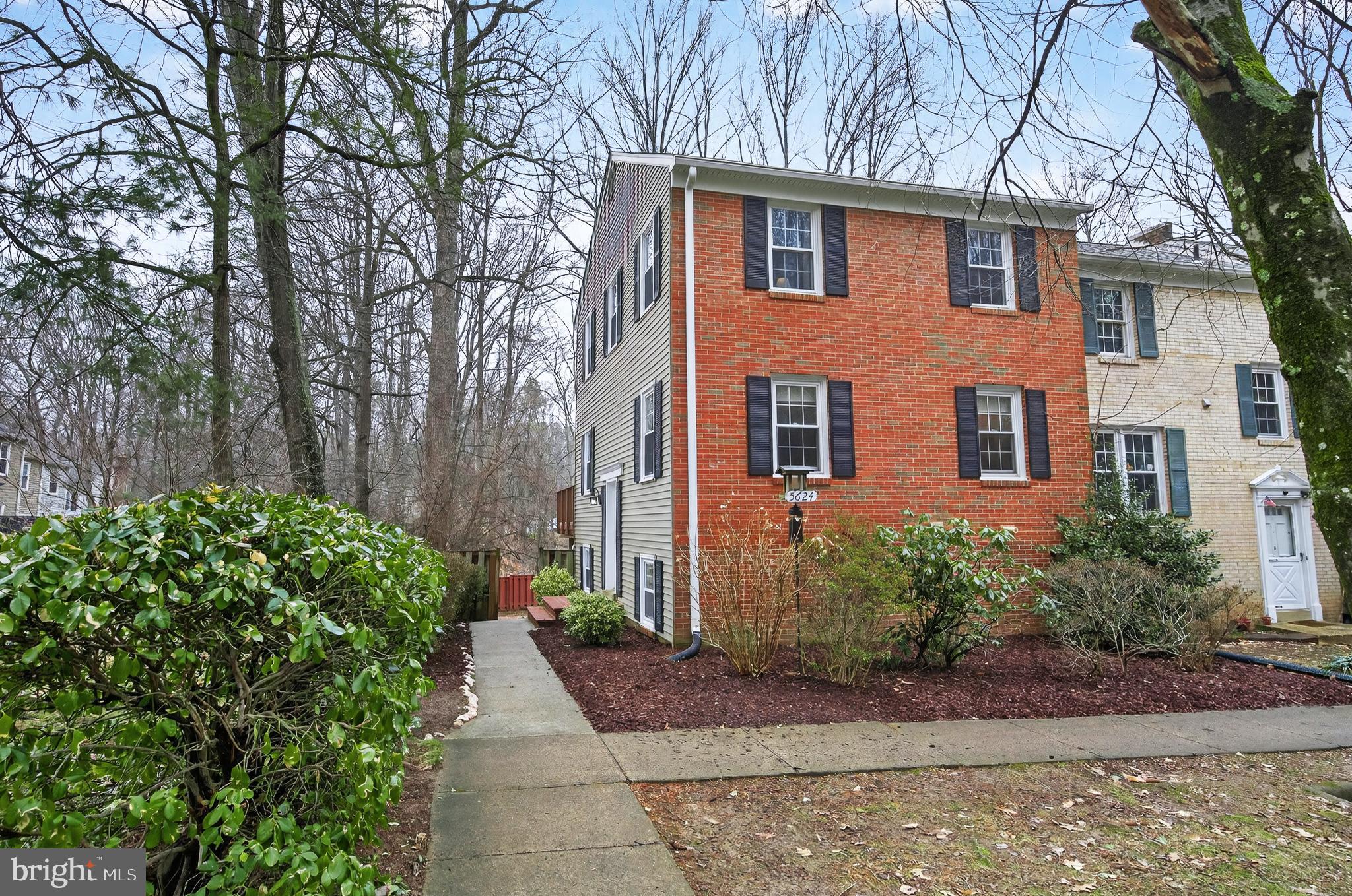 5624 Kirkham Court Springfield, VA 22151 - Photo 2 of 52 a front view of a house with garden
