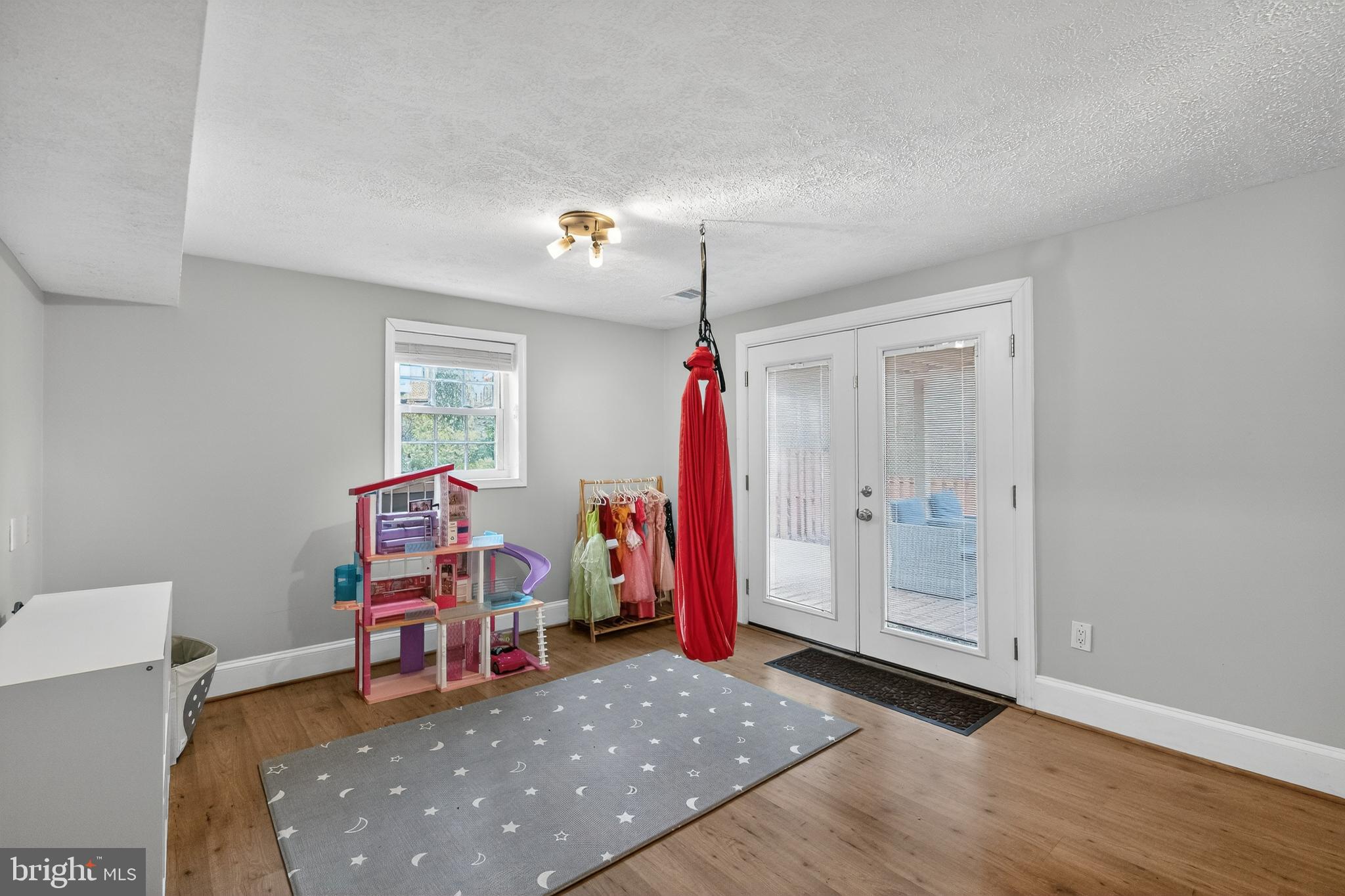 5624 Kirkham Court Springfield, VA 22151 - Photo 29 of 52 a living room with furniture and a wooden floor
