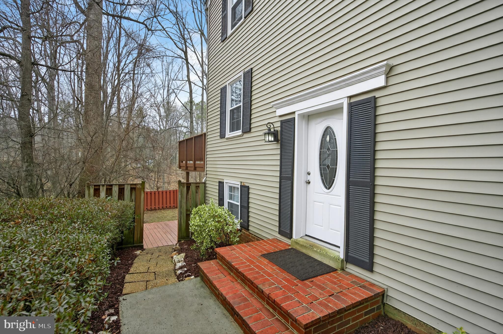 5624 Kirkham Court Springfield, VA 22151 - Photo 3 of 52 a view of a backyard with plants and a patio