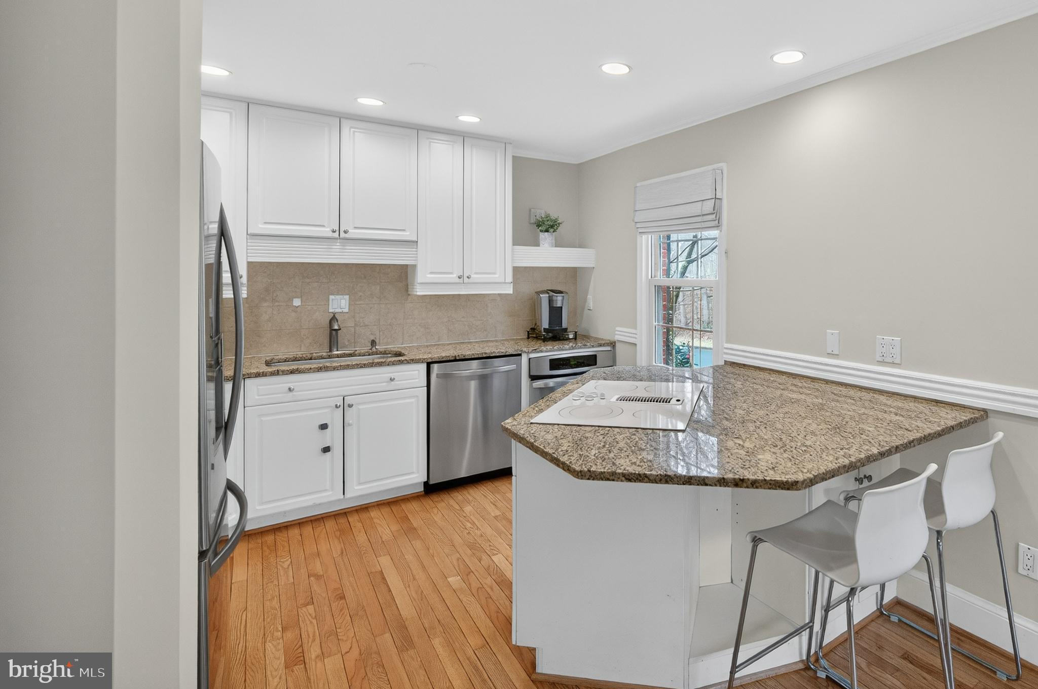 5624 Kirkham Court Springfield, VA 22151 - Photo 5 of 52 a kitchen with stainless steel appliances granite countertop a sink and cabinets