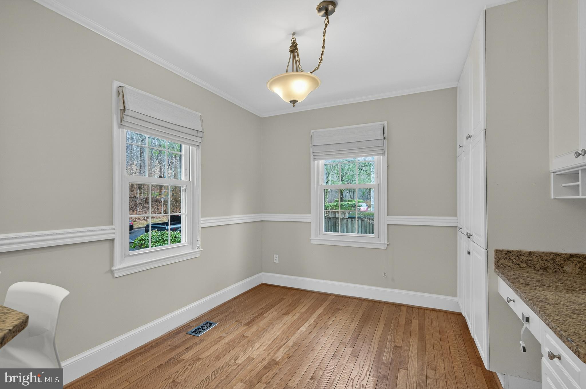 5624 Kirkham Court Springfield, VA 22151 - Photo 9 of 52 a view of an empty room with wooden floor and a window