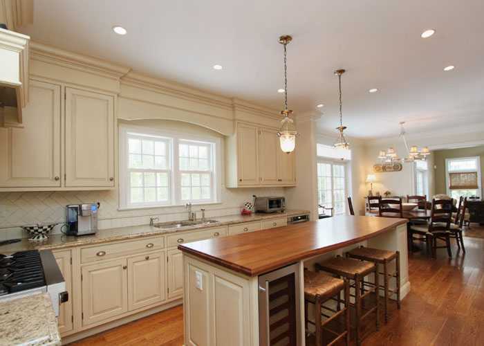 17 Dorchester Lane Riverside, CT 06878 - Photo 3 of 11 a kitchen with lots of counter space a sink appliances and living room view