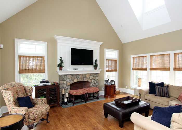 17 Dorchester Lane Riverside, CT 06878 - Photo 5 of 11 a living room with furniture a flat screen tv and a fireplace