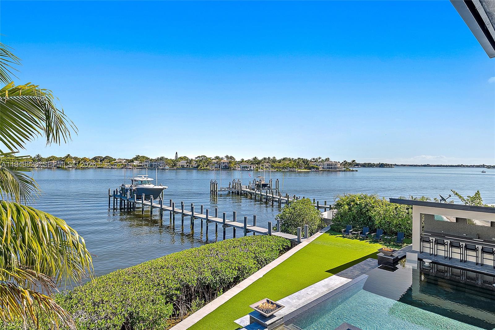 9 Bamboo Lane Jupiter, FL 33458 - Photo 32 of 46 Covered Balcony View Backyard