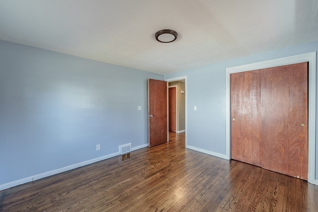 85 West Allen Ridge Road Springfield, MA 01118 - Photo 11 of 41 an empty room with wooden floor and windows